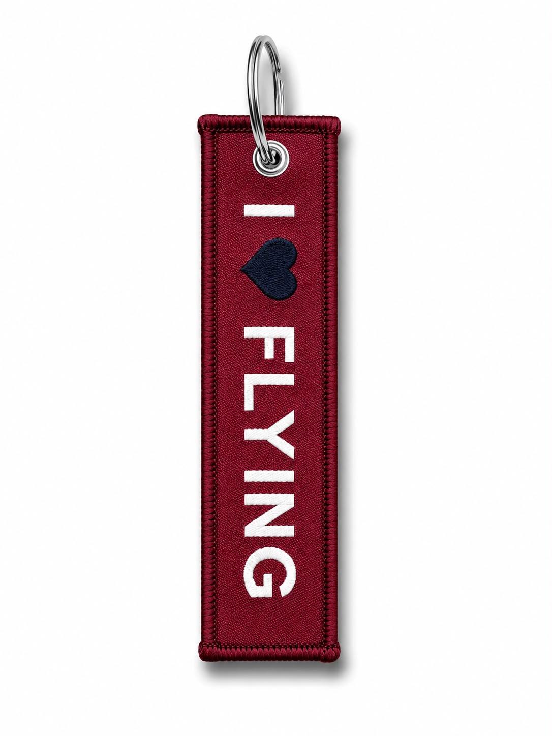 Kumaş anahtarlık "I Love Flying" Bordo, pilot temalı, şık ve dayanıklı anahtarlık, uçuş severler için ideal aksesuar.