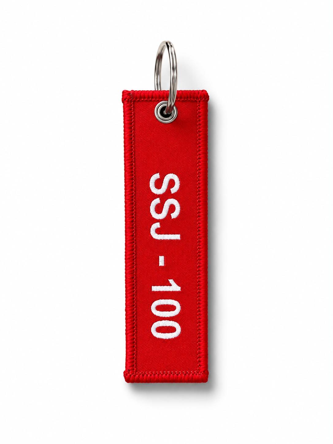Kırmızı renkli Redwings kumaş anahtarlık, dayanıklı ve şık anahtarlık aksesuarı, renkli tasarımıyla dikkat çekiyor.