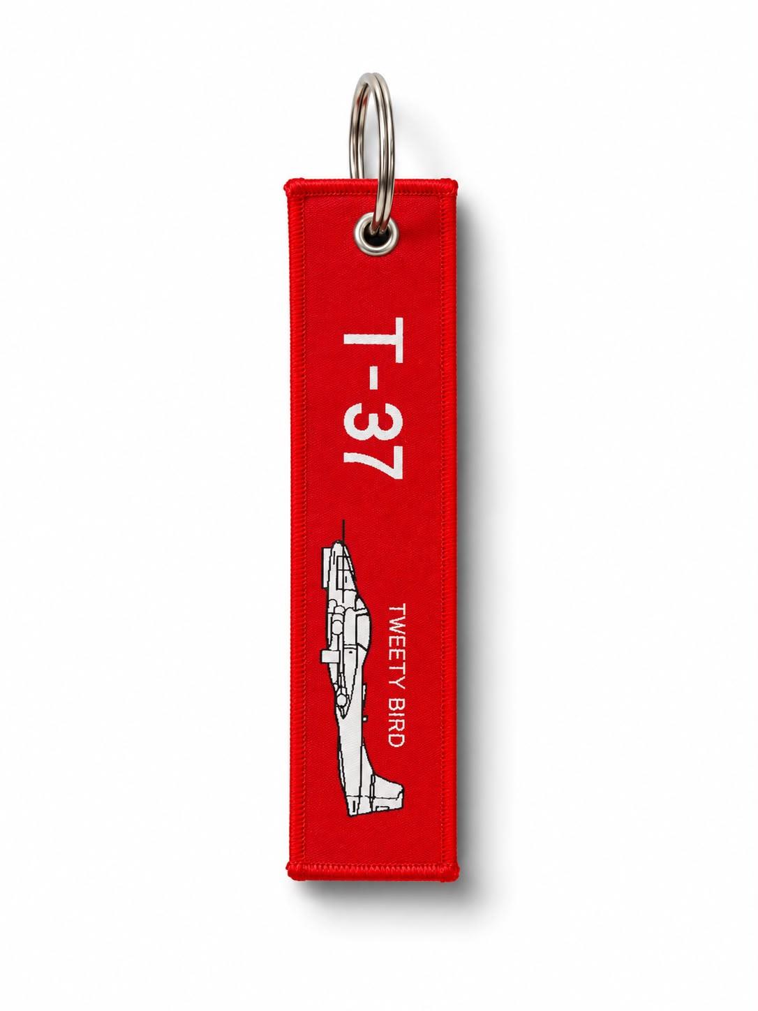 Kırmızı kumaş anahtarlık "T-37+ RBF" Pilot Shop Bakırköy, dayanıklı ve şık anahtarlık aksesuarı.