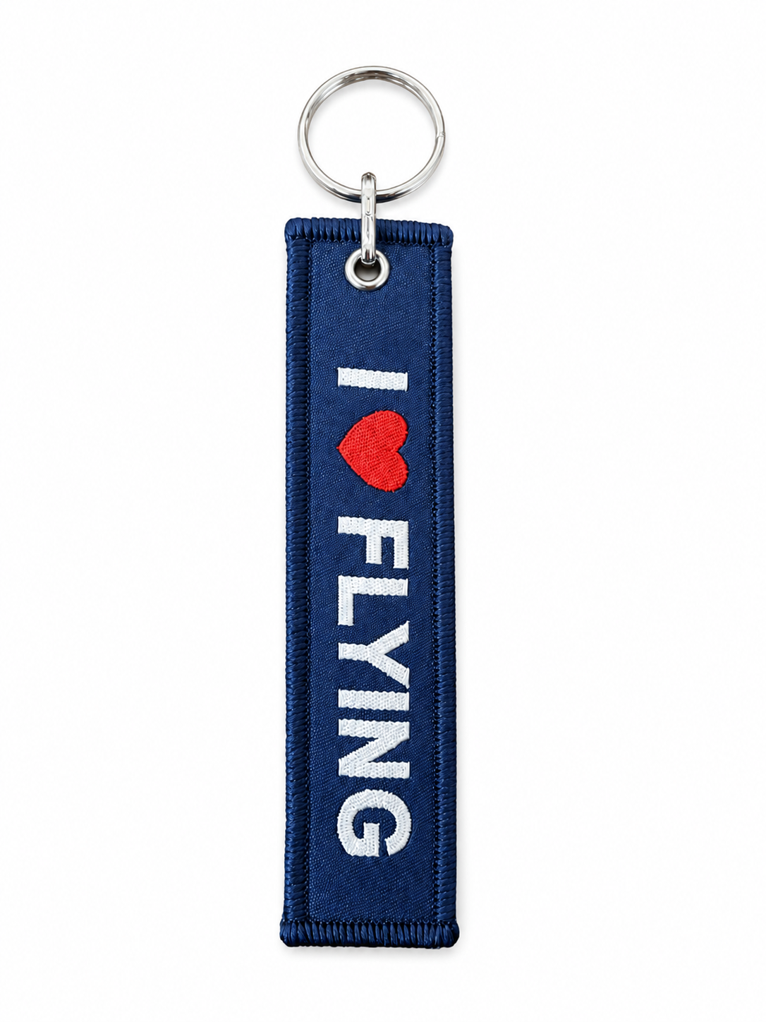 İki renkli kumaş anahtarlık, "I Love Flying" ve "Kiss Me" yazılı, Pilot Shop Bakırköy markalı dekoratif anahtar tutucu.