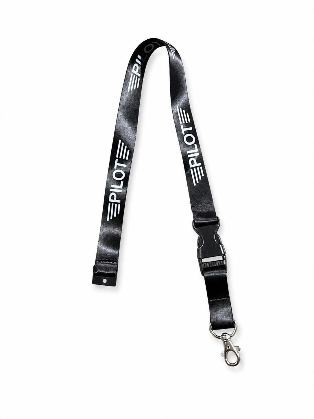 Pilot markalı Lanyard Pilot AKSESUARLAR, kırmızı ve siyah renkli, boyun için kullanışlı ve dayanıklı tasarım.